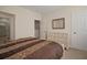 Bedroom with dresser and access to bathroom and closet at 322 Ibisview Ln, Apollo Beach, FL 33572