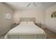 Primary bedroom with king-size bed and nightstands at 322 Ibisview Ln, Apollo Beach, FL 33572