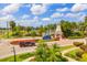Gated entrance to community with landscaping and lake view at 322 Ibisview Ln, Apollo Beach, FL 33572