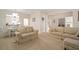 Bright dining area with a white table and chairs, offering a view of the kitchen at 322 Ibisview Ln, Apollo Beach, FL 33572