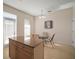 Kitchen with granite island, light cabinets, and stainless steel appliances at 322 Ibisview Ln, Apollo Beach, FL 33572
