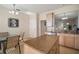 Kitchen with granite island, light cabinets, stainless steel appliances and view to dining area at 322 Ibisview Ln, Apollo Beach, FL 33572