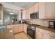 Modern kitchen with stainless steel appliances and granite countertops, island at 322 Ibisview Ln, Apollo Beach, FL 33572