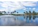 Scenic lake view with fountain, bridge, and palm trees at 322 Ibisview Ln, Apollo Beach, FL 33572