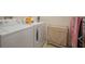 Bright laundry room with washer, dryer, and storage at 322 Ibisview Ln, Apollo Beach, FL 33572