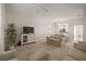 Living room with beige sofas, a TV stand, and an open floor plan at 322 Ibisview Ln, Apollo Beach, FL 33572