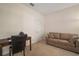Home office features a desk, chair, couch, and ample natural light at 322 Ibisview Ln, Apollo Beach, FL 33572