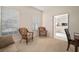 Open office area with two wicker armchairs and view into living room at 322 Ibisview Ln, Apollo Beach, FL 33572