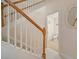 Elegant staircase with wooden railing leading to upper level at 322 Ibisview Ln, Apollo Beach, FL 33572