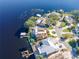 Aerial view showing a waterfront home with a large backyard and private dock at 36 Freshwater Dr, Palm Harbor, FL 34684