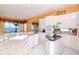 Spacious kitchen featuring granite countertops and white cabinetry at 36 Freshwater Dr, Palm Harbor, FL 34684