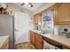 Kitchen with wood cabinets, stainless steel appliances at 401 Davison Ne Ave, St Petersburg, FL 33703