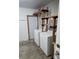 Laundry room with washer, dryer, shelving, and additional storage at 4510 Helena Ne St, St Petersburg, FL 33703