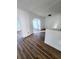 Open living area with wood-look flooring and archway at 4510 Helena Ne St, St Petersburg, FL 33703