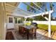 Cozy patio with wooden dining table, pergola, and grill at 4510 Helena Ne St, St Petersburg, FL 33703