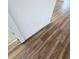 Close-up view of a wall with textured paint and wood-look flooring at 4510 Helena Ne St, St Petersburg, FL 33703