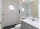 Modern bathroom with marble tile and updated fixtures at 5011 Sandy Brook Cir, Wimauma, FL 33598