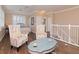 Upstairs bedroom with sitting area and ensuite bathroom at 5011 Sandy Brook Cir, Wimauma, FL 33598