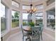 Bright breakfast nook with water views and seating for four at 5011 Sandy Brook Cir, Wimauma, FL 33598