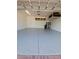 Garage with epoxy flooring and overhead storage at 5011 Sandy Brook Cir, Wimauma, FL 33598