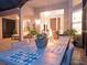 Covered patio with dining table and seating at 5011 Sandy Brook Cir, Wimauma, FL 33598