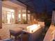 Covered patio with fire pit and seating area at 5011 Sandy Brook Cir, Wimauma, FL 33598