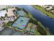 Aerial view of community pickleball courts and bocce ball at 5011 Sandy Brook Cir, Wimauma, FL 33598