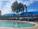 Inviting pool with shaded seating and a swimming at 5011 Sandy Brook Cir, Wimauma, FL 33598