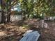 Backyard with mature trees and building materials at 5809 23Rd S Ave, Gulfport, FL 33707