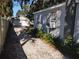 Gravel driveway leading to a detached garage at 5809 23Rd S Ave, Gulfport, FL 33707