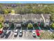 Aerial view of townhome community showcasing building and parking at 6307 Osprey Lake Cir, Riverview, FL 33578