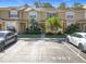 Front view of townhome with parking and landscaping at 6307 Osprey Lake Cir, Riverview, FL 33578