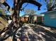 Backyard view with shed and mature tree providing shade at 6928 E 29Th Ave, Tampa, FL 33619