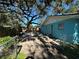 Large backyard with a shed and mature trees at 6928 E 29Th Ave, Tampa, FL 33619