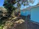 Backyard with mature trees and a shed at 6928 E 29Th Ave, Tampa, FL 33619