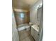 Clean bathroom with a tub, toilet, and vanity at 6928 E 29Th Ave, Tampa, FL 33619