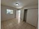 Bright bedroom with closet and access to bathroom at 6928 E 29Th Ave, Tampa, FL 33619