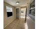 Small bedroom with tile floors, a closet, and a window at 6928 E 29Th Ave, Tampa, FL 33619