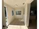 Sunlit entryway with tile floors, leading to other rooms at 6928 E 29Th Ave, Tampa, FL 33619