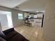 Bright kitchen features granite countertops and white cabinets at 6928 E 29Th Ave, Tampa, FL 33619