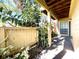 Covered patio with a view of the backyard and wooden fence at 8714 Mallard Reserve Dr # 104, Tampa, FL 33614