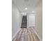 Basement hallway with wood-look flooring and storage at 4522 Bay Spring Ct, Tampa, FL 33611