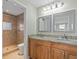Bathroom with double vanity, granite countertop, and shower at 4522 Bay Spring Ct, Tampa, FL 33611