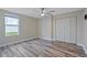 Bright bedroom with ceiling fan and double-door closet at 4522 Bay Spring Ct, Tampa, FL 33611