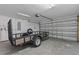 Garage with utility trailer and overhead door at 4522 Bay Spring Ct, Tampa, FL 33611