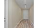 Light and airy hallway with wood-look flooring at 4522 Bay Spring Ct, Tampa, FL 33611