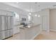 Modern kitchen with granite counters and stainless steel appliances at 4522 Bay Spring Ct, Tampa, FL 33611