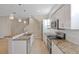 Modern kitchen with granite countertops and white cabinets at 4522 Bay Spring Ct, Tampa, FL 33611