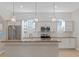 Modern kitchen with granite countertops and white cabinets at 4522 Bay Spring Ct, Tampa, FL 33611