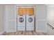 Laundry room with washer, dryer, and built-in cabinets at 4522 Bay Spring Ct, Tampa, FL 33611